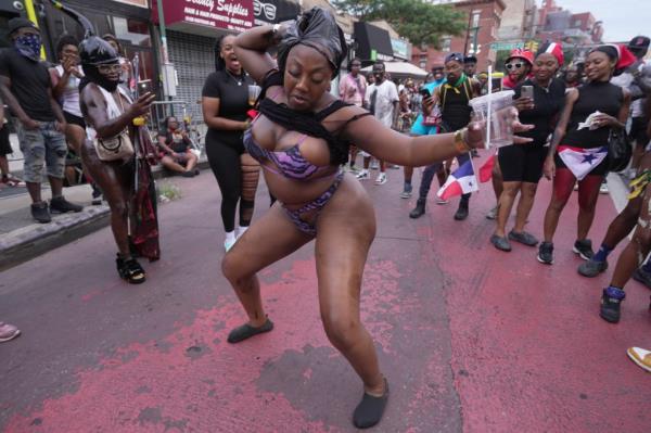 People participate in the annual J'Ouvert festival celebration on Monday, September 2, 2024 