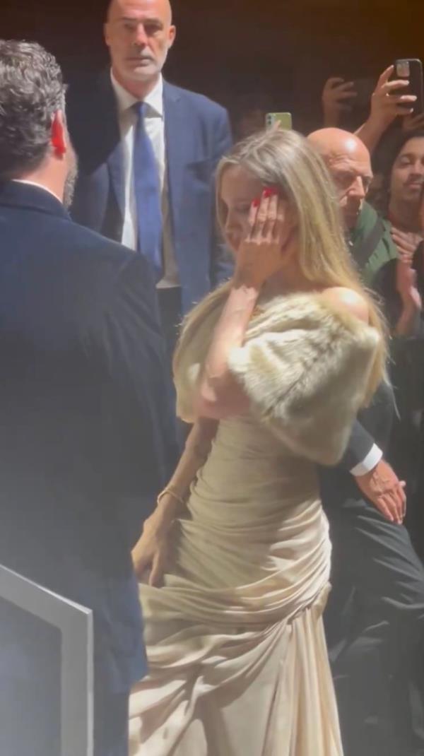 Angelina Jolie standing in a crowd. 