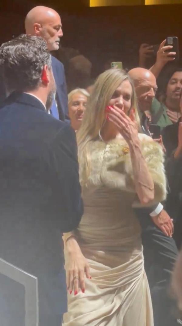 Angelina Jolie covering her mouth. 