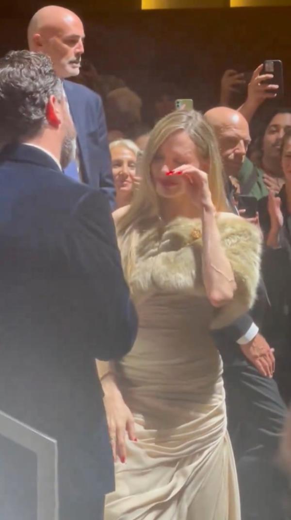Angelina Jolie wiping her eyes. 