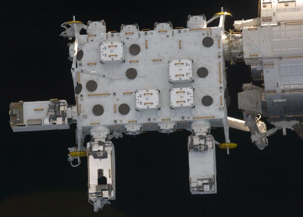 The crew members exchange farewells, with Koichi Wakata of the Japan Aerospace Exploration Agency, left, appearing a little reluctant to leave after spending 133 days aboard the space station