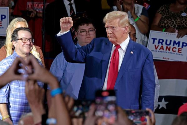 Former US President and Republican presidential candidate Do<em></em>nald Trump attends a town hall meeting moderated by Arkansas Governor Sarah Huckabee Sanders at the Dort Financial Center in Flint, Michigan, on September 17, 2024.