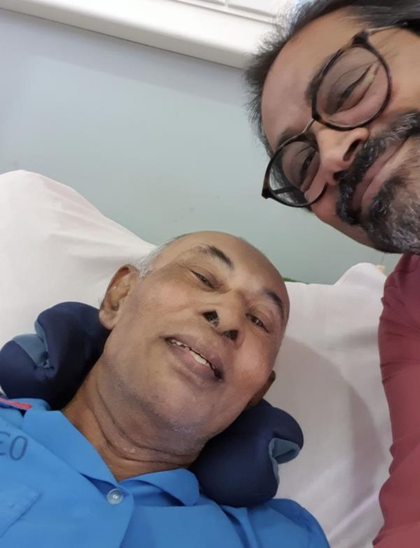 The writer visiting his former teacher, Mr Denis Doss, in hospital. Photo: Albert Dorairaj