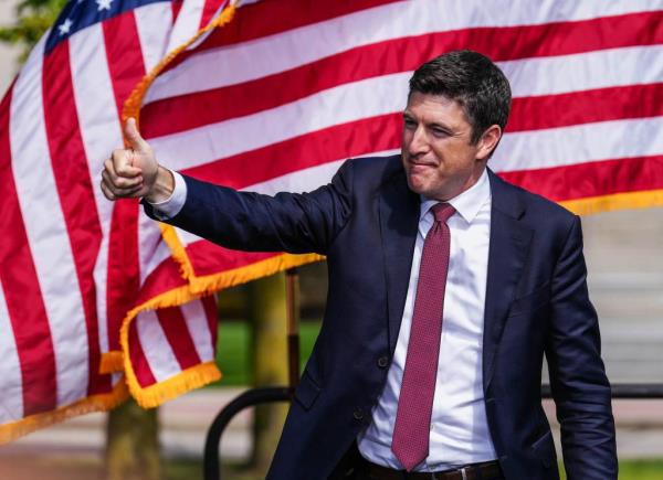 U.S. Representative Bryan Steil giving a thumbs up while taking the stage at a press co<em></em>nference on crime and safety in Kenosha, Wisconsin