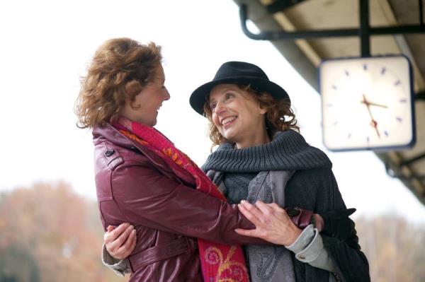 lesbian couple holding each other, high school sweetheart marriage advice