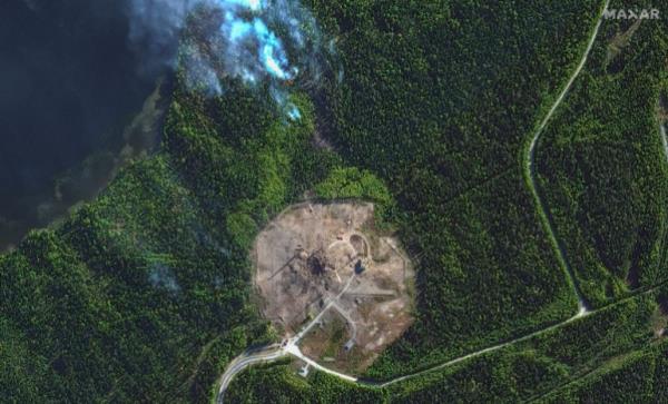 The site after the tests. There is a large crater. Roads are no lo<em></em>nger visible. There is one building