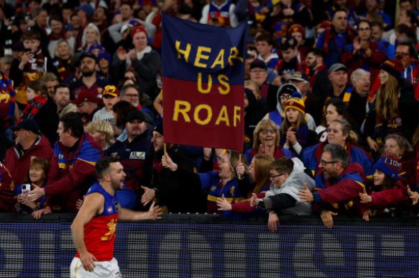 Lions fan Adam Staines made the decision to shell out $1200 for two fares to Melbourne after Brisbane’s victory over Geelong on Saturday. 