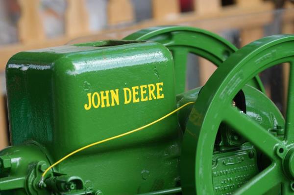 A green John Deere machine operating at the Kentucky State Fair on August 16, 2024.