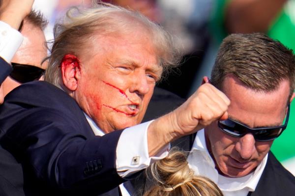 Republican presidential candidate former President Do<em></em>nald Trump reacts following an assassination attempt at a campaign event in Butler, Pa., on Saturday, July 13, 2024