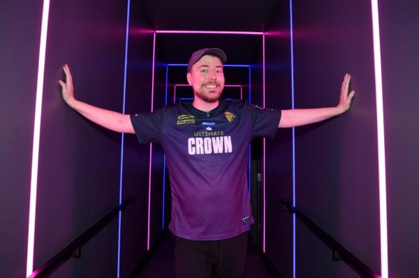 MrBeast in a purple shirt at Amazon's Prime Day Ultimate Crown gaming event in Las Vegas, Nevada, competing against Ninja.