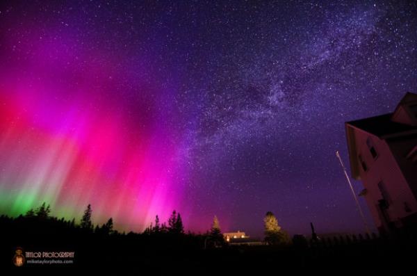 Starry night with vivid colors from an aurora at the left side of the image.