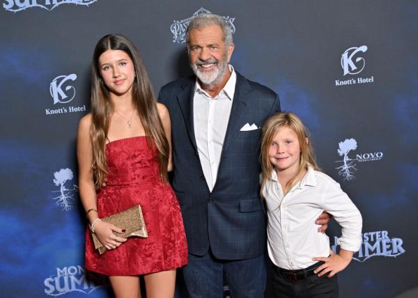 Mel Gibson with his daughter Lucia and son Lars posing for a photo at the Mo<em></em>nster Summer premiere in Los Angeles, California.