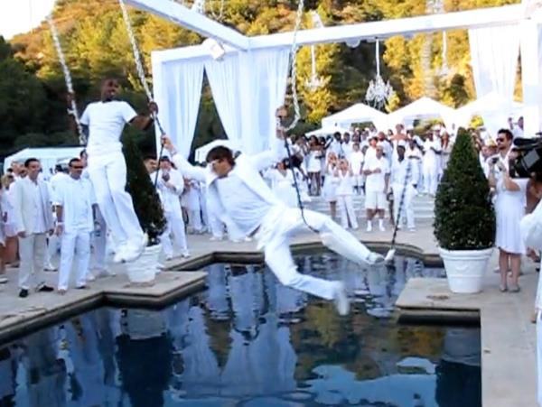 Ashton Kutcher in a white suit at Diddy's party promoting Malaria No More, July 4th 2009.