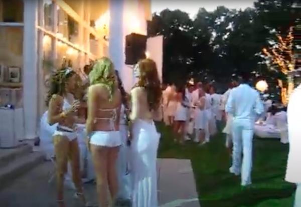 Sean Love Combs, also known as Diddy, hosting a White Party on July 4, 2009 in Bel Air with a group of models in white bikinis
