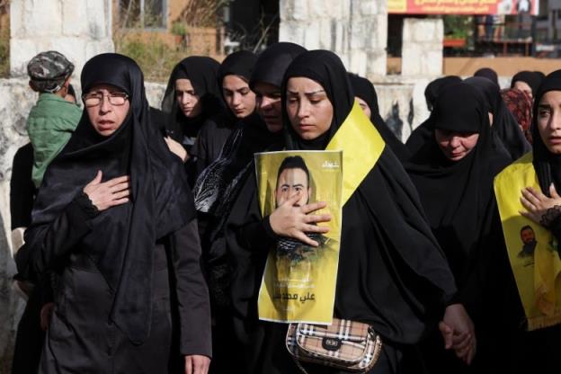 Mourners attend the funeral of Hezbollah member Ali Mohamed Chalbi, after hand-held radios and pagers used by Hezbollah deto<em></em>nated across Lebanon, in Kfar Melki, Lebanon September 19, 2024.