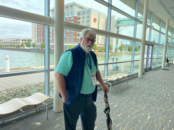 Jim Milleson leans on his umbrella at the Shale Insight Co<em></em>nference in Erie, Pennsylvania.