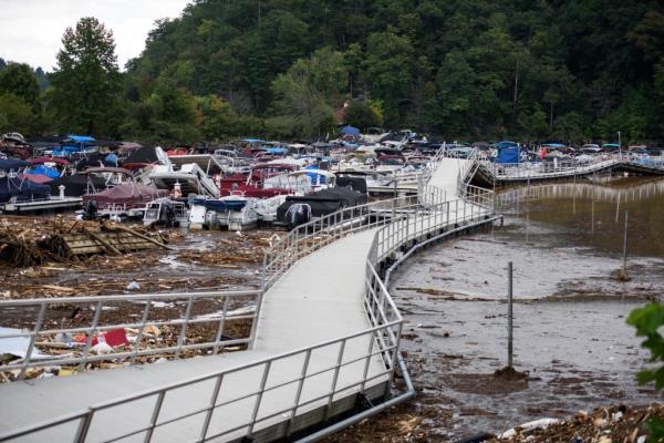 The Rocky Broad River flows into Lake Lure and overflows the town with debris from Chimney Rock, North Carolina on Sept. 28, 2024.