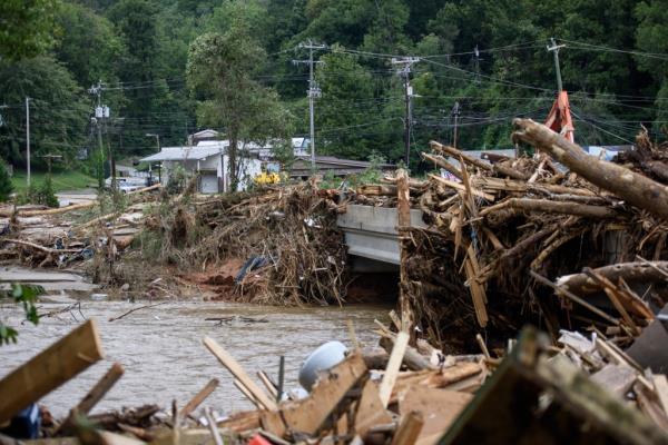 Trees and other debris gather on roadways in Chimney Rock, North Carolina.