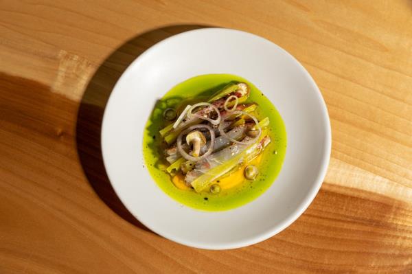 Kampachi Crudo, with mushrooms, fermented husk cherry salsa, celtuce and chicharron furikake
