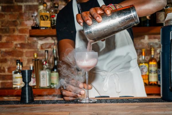 Bartender making a cocktail at Bar Contra