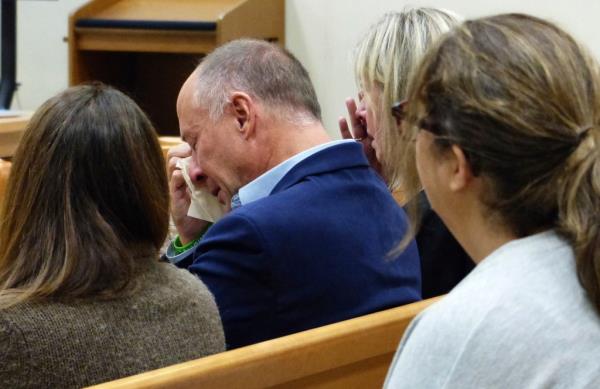 Mark Barden wipes away tears after his testimony during the Alex Jo<em></em>nes Sandy Hook defamation damages trial at Co<em></em>nnecticut Superior Court in Waterbury, Conn.,