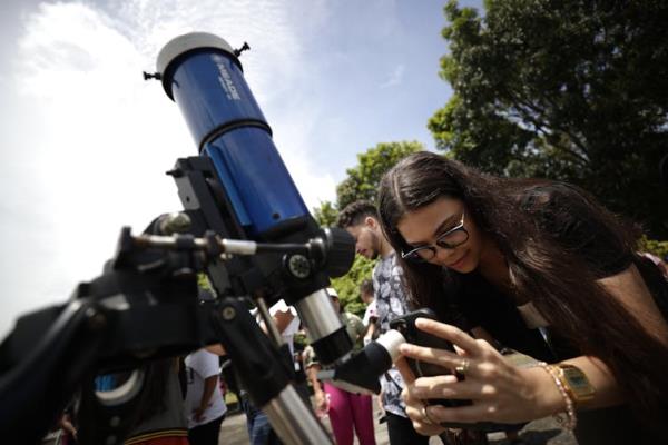 Skywatchers preparing for an annular eclipse.