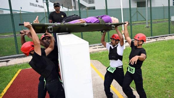 Running in a gas mask, unlocking handcuffs in the dark: The road to joining Singapore's elite prison force
