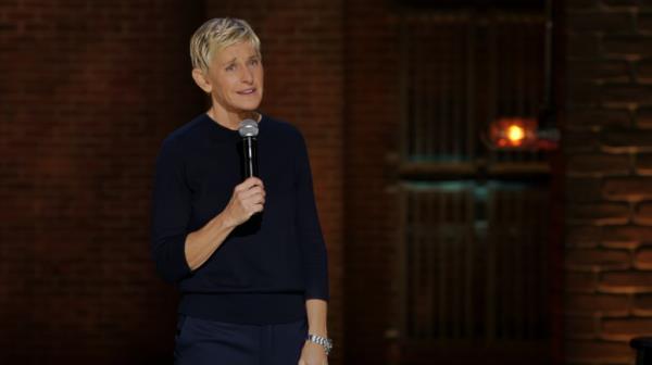 Ellen DeGeneres holding a microphone, speaking a<em></em>bout her decision to ditch cosmetic procedures for a Netflix show