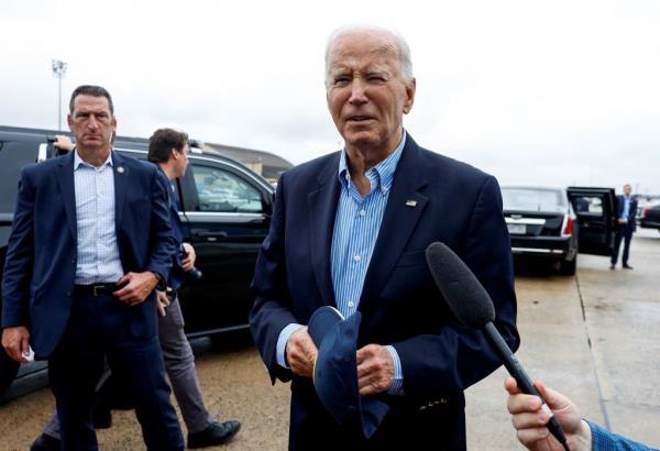 Joe Biden speaks to members of the media before boarding Air Force One en route to North and South Carolina, in the wake of Hurricane Helene, at Joint ba<em></em>se Andrews, Maryland, U.S., October 2, 2024.
