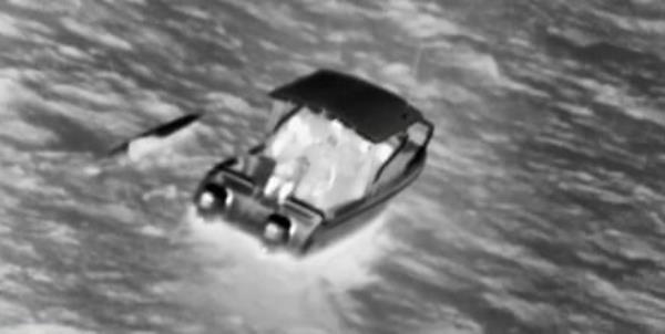 A boat and a kayak in black and white.