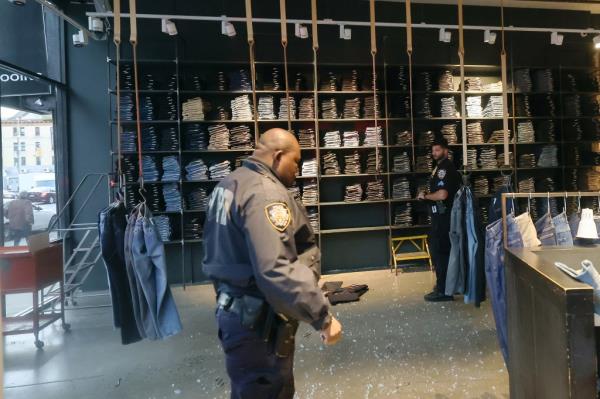 Police officers respo<em></em>nding to the burglary at Nudie Jeans Repair Shop.