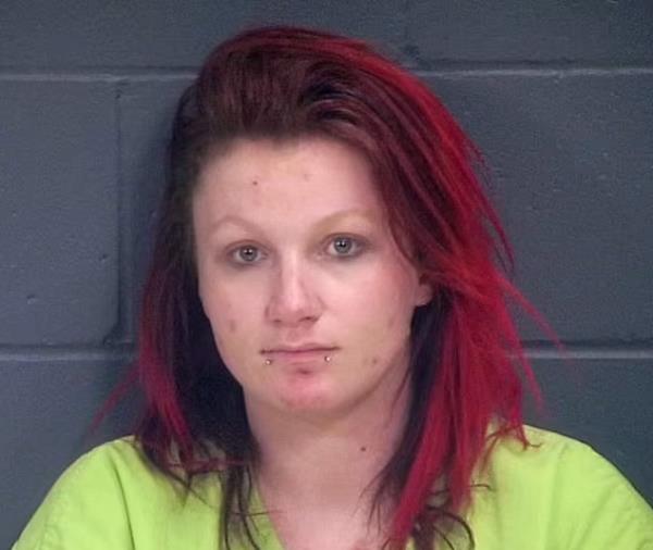 A woman with red hair and piercings, Chelsea Belle O'Donnell, arrested on charges of child neglect and drugs.