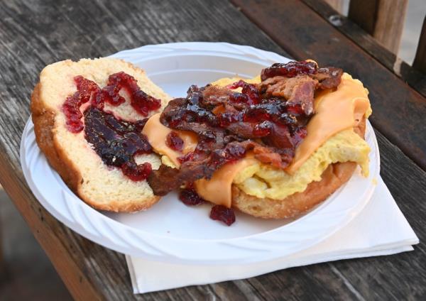 Jelly doughnut with bacon, egg, and cheese from Best Deli & Grill, a twist on the classic NYC breakfast