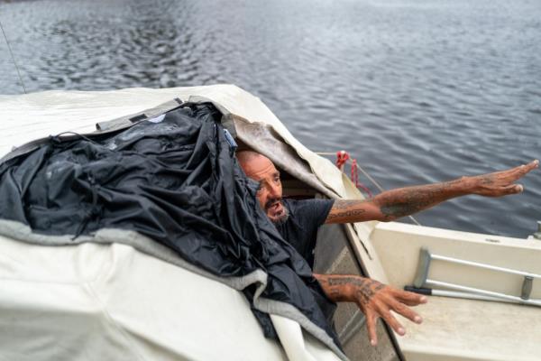 Tampa police try to persuade a local resident who is living on his boat known as Jay and nicknamed Lieutenant Dan to leave for his safety as Tampa prepares for the arrival of Hurricane Milton on October 09, 2024 in Tampa, Florida