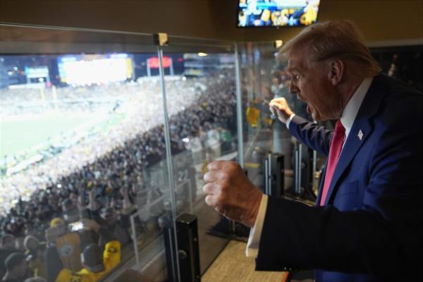 Former President Do<em></em>nald Trump, the Republican presidential nominee for 2024, passio<em></em>nately cheering at the New York Jets versus Pittsburgh Steelers football game.