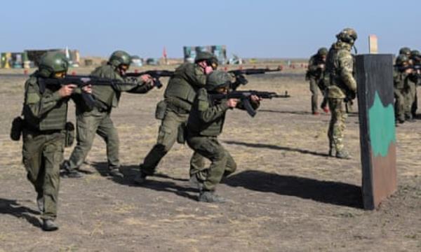 New recruits point their assault rifles as they undergo training