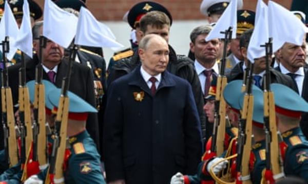 Vladimir Putin attends a wreath-laying ceremony at the Tomb of the Unknown Soldier after the Victory Day military parade in Moscow