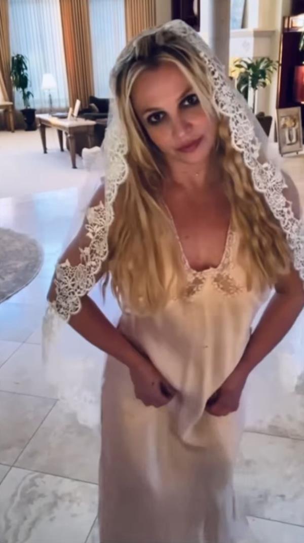 Britney Spears in a white dress and veil