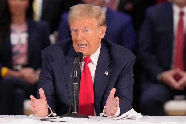 Former President Do<em></em>nald Trump, the Republican presidential nominee, speaking into a microphone at a roundtable with Latino leaders in Doral, Florida, during his 2024 campaign