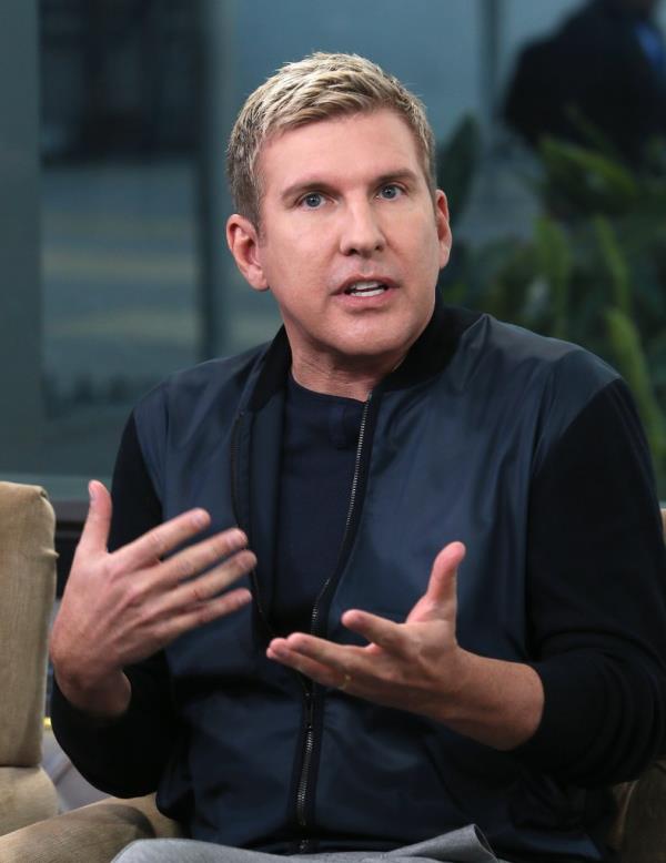 Todd Chrisley lost his job in prison because he talked too much.