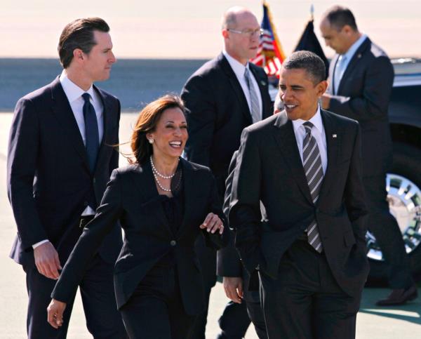 President Barack Obama walking with Kamala Harris and Gavin Newsom after arriving in San Francisco on Air Force One for fundraising events in 2012.