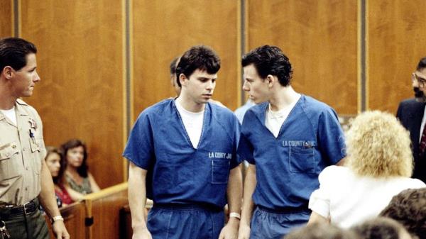 Lyle, left, and Erik Menendez leave courtroom in Santa Monica, Calif., Aug. 6, 1990, after a judge ruled that co<em></em>nversations between the two brothers and their psychologist after their parents were slain are not privileged and can be used as evidence in their murder case. (AP Photo/Nick Ut)