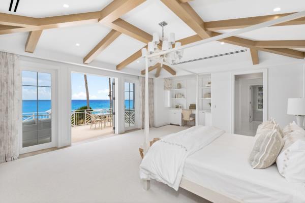 Bedroom with a terrace overlooking the ocean in an $88M Palm Beach home