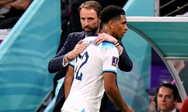 England’s Jude Bellingham is given a hug by Gareth Southgate.
