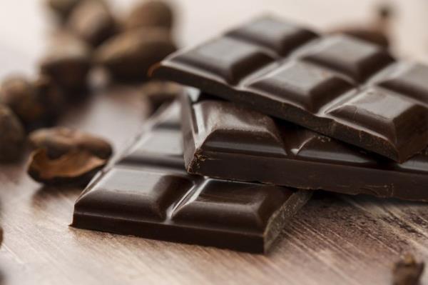 Gourmet dark chocolate bar with cocoa beans
