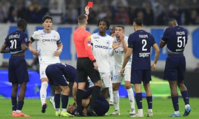 Amine Harit (third from right) reacts after being sent off by François Letexier.