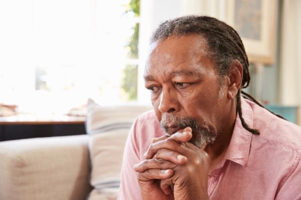anxious, sad, or depressed man sitting on a couch