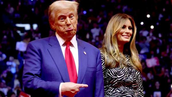 Do<em></em>nald Trump points his finger next to Melania Trump during a campaign rally at Madison Square Garden.
Pic: Reuters
