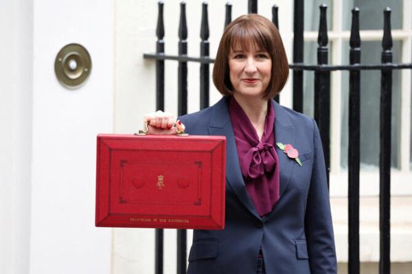 Britain's Chancellor of the Exchequer Rachel Reeves poses with the red budget box outside her office on Downing Street in London, Britain October 30, 2024. (Reuters)