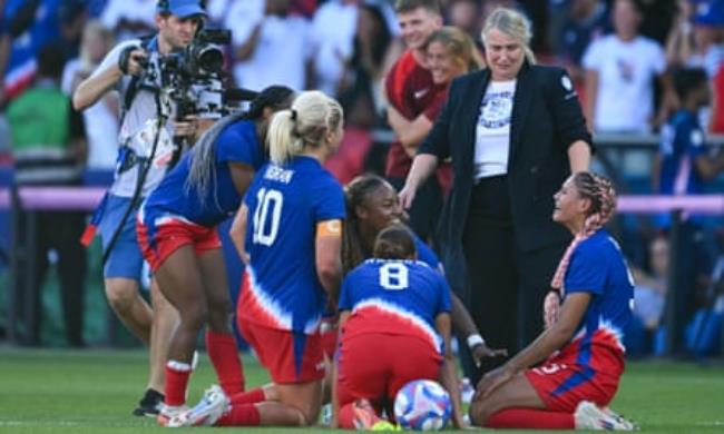 Emma Hayes (second left) celebrates with her players after the US win Olympic gold